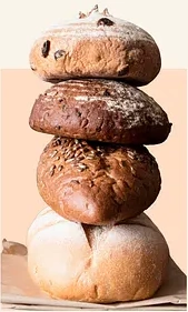 Four rustic artisan loaves stacked high